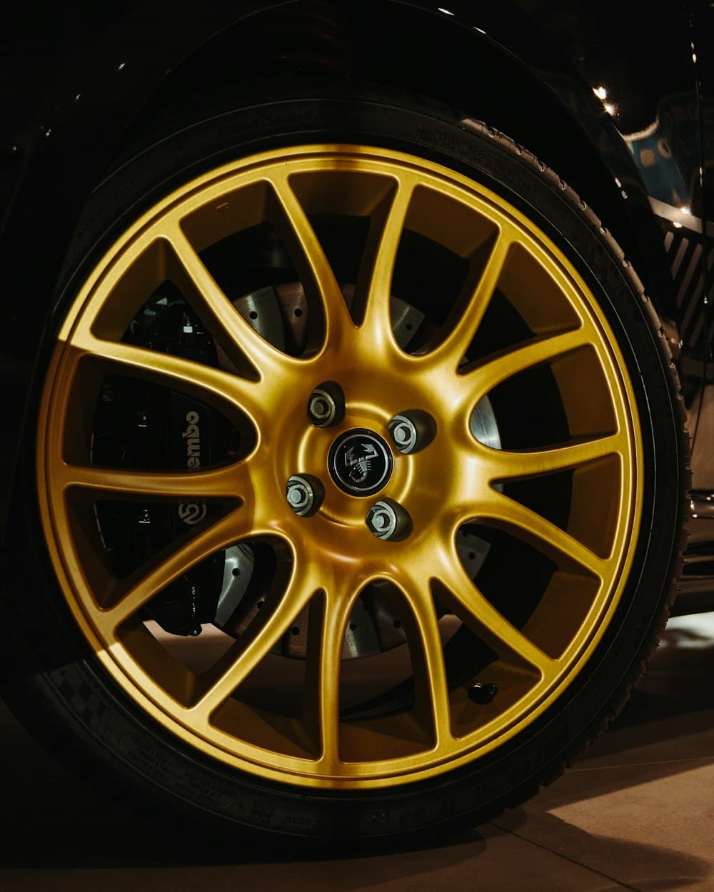 A gold multi-spoke alloy wheel